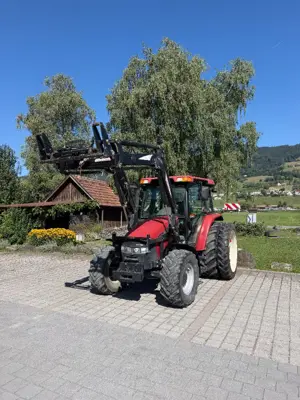 Case IH JX1070U mit Hydrac Frontlader