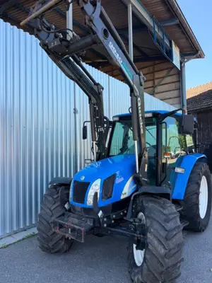 Traktor NEW HOLLAND TL90A MIT FRONTLADER
