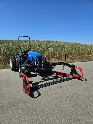 New Holland Bergtrac mit Doppelmessermähwerk